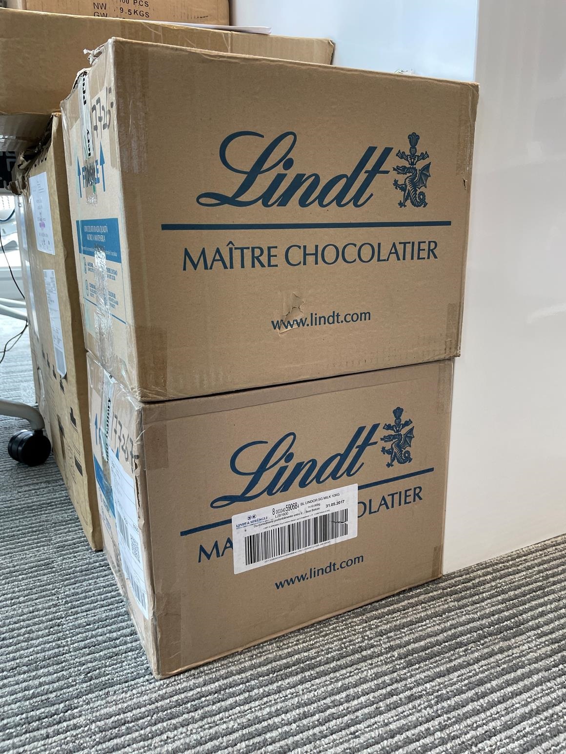 Two cardboard boxes marked 'chocolate'