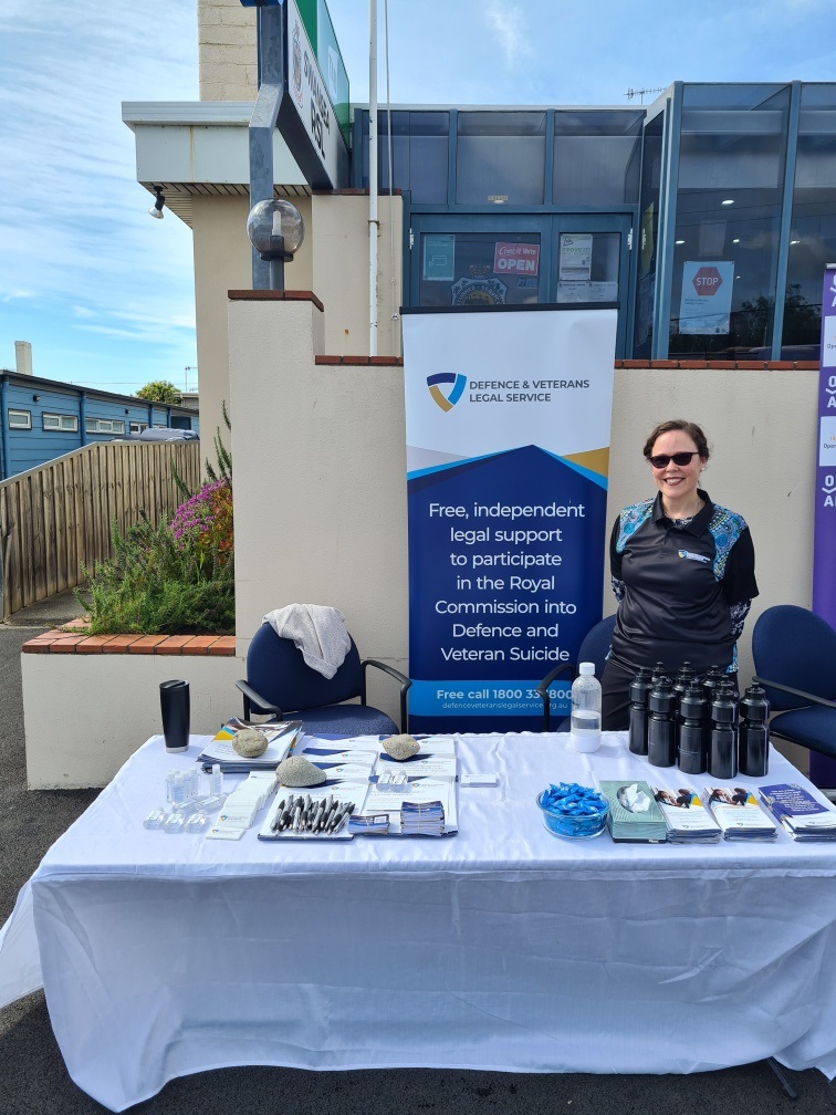 Lawyer Clare Mittermayer at a DAVLS outreach standing in front of a sign