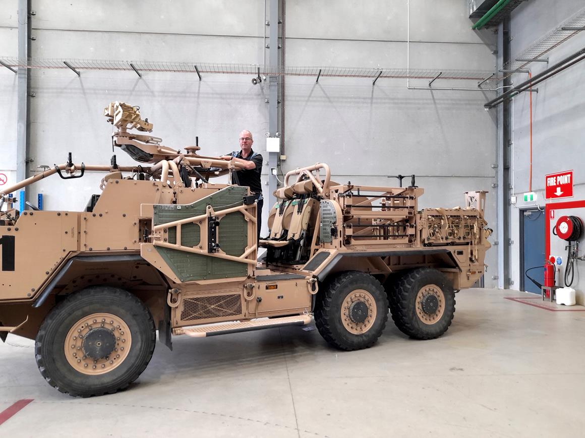 Man, lawyer Gerry Stapleton, on a military truck